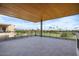 Large patio with golf course views and a wood-beamed ceiling at 6311 E Phoenician Blvd # 21, Scottsdale, AZ 85251