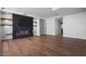 Spacious living room with hardwood floors, fireplace, and built-in shelving at 6311 E Phoenician Blvd # 21, Scottsdale, AZ 85251