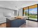 Gourmet kitchen with island, stainless steel appliances, and golf course views at 6311 E Phoenician Blvd # 21, Scottsdale, AZ 85251