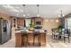 Modern kitchen with island, stainless steel appliances, and breakfast bar at 649 N 67Th Dr # 25, Phoenix, AZ 85043