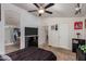 Comfortable bedroom with ensuite bathroom access and a TV at 649 N 67Th Dr # 25, Phoenix, AZ 85043