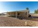 Side view of home with carport and landscaping at 649 N 67Th Dr # 25, Phoenix, AZ 85043