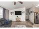 Bright living room featuring comfortable seating and a large TV at 649 N 67Th Dr # 25, Phoenix, AZ 85043