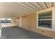 Covered patio with exterior access and window at 649 N 67Th Dr # 25, Phoenix, AZ 85043