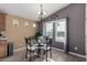 Cozy dining area with glass table and four chairs at 649 N 67Th Dr # 25, Phoenix, AZ 85043