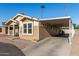 Tan home with carport and small front porch at 649 N 67Th Dr # 25, Phoenix, AZ 85043