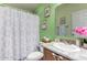 Clean bathroom with shower, vanity, and new flooring at 649 N 67Th Dr # 25, Phoenix, AZ 85043