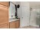 Bathroom with shower, vanity, and built-in cabinets at 649 N 67Th Dr # 25, Phoenix, AZ 85043