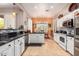 Spacious kitchen with white cabinets, black countertops, and stainless steel appliances at 7179 E Palo Brea Dr, Gold Canyon, AZ 85118