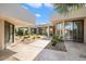 Private courtyard with flagstone paths and drought-tolerant landscaping at 8565 E Vista Del Lago N --, Scottsdale, AZ 85255