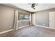 Bedroom with ceiling fan, window, and mirrored closet at 1045 N Granite Reef Rd, Scottsdale, AZ 85257