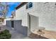 Side yard view with a gated entrance and small patio table at 1045 N Granite Reef Rd, Scottsdale, AZ 85257