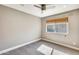 Spacious bedroom with carpeted floors and ceiling fan at 1045 N Granite Reef Rd, Scottsdale, AZ 85257