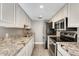 Modern kitchen with granite countertops and stainless steel appliances at 1045 N Granite Reef Rd, Scottsdale, AZ 85257