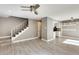 Living room with gray walls, wood-look floors, and stairs at 1045 N Granite Reef Rd, Scottsdale, AZ 85257