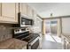 Modern kitchen features stainless steel appliances and granite countertops at 1045 N Granite Reef Rd, Scottsdale, AZ 85257