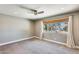 Bedroom with carpeted floor, window, and ceiling fan at 1045 N Granite Reef Rd, Scottsdale, AZ 85257