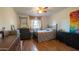 Cozy bedroom with double bed, wood floors, and ceiling fan at 2047 W Maryland Ave, Phoenix, AZ 85015