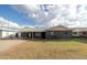 Ranch-style home with dark gray exterior and carport at 2047 W Maryland Ave, Phoenix, AZ 85015