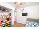 Spacious bedroom with a bed and toy area at 2047 W Maryland Ave, Phoenix, AZ 85015