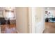 Hallway view of bedroom with wood floors and ceiling fan at 2047 W Maryland Ave, Phoenix, AZ 85015