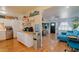 Open concept kitchen and living area with modern finishes and blue sofa at 2047 W Maryland Ave, Phoenix, AZ 85015