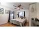 Primary bedroom with a metal bed frame and skull decor at 2047 W Maryland Ave, Phoenix, AZ 85015