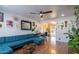 Living room with teal sectional sofa and wood floors at 2047 W Maryland Ave, Phoenix, AZ 85015