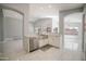 Modern kitchen with white cabinets and a farmhouse sink at 7469 W Monona Dr, Glendale, AZ 85308