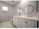 Bathroom boasts double vanity and updated fixtures at 7469 W Monona Dr, Glendale, AZ 85308