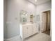 Double vanity bathroom with large mirror and shower at 7469 W Monona Dr, Glendale, AZ 85308