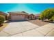 House exterior showcasing a two-car garage at 7469 W Monona Dr, Glendale, AZ 85308