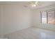 Bright bedroom with tile flooring and large window at 7469 W Monona Dr, Glendale, AZ 85308