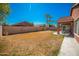 Backyard features grassy area and covered patio at 7469 W Monona Dr, Glendale, AZ 85308