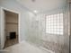 Bathroom with walk-in shower and pebble floor at 7469 W Monona Dr, Glendale, AZ 85308