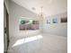 Bright dining room with large windows and chandelier at 7469 W Monona Dr, Glendale, AZ 85308