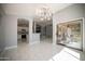 Bright dining area with kitchen views and access to the backyard at 7469 W Monona Dr, Glendale, AZ 85308