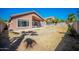 Large backyard with covered patio and grassy area at 7469 W Monona Dr, Glendale, AZ 85308