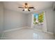 Well-lit bedroom with large window and ceiling fan at 7469 W Monona Dr, Glendale, AZ 85308