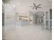 Open living area with tile flooring and a ceiling fan at 7469 W Monona Dr, Glendale, AZ 85308