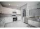 Modern kitchen with white cabinets and a large island at 7469 W Monona Dr, Glendale, AZ 85308