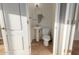 Small powder room with pedestal sink and toilet at 944 S Grand --, Mesa, AZ 85210