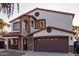 Two-story house with stone accents and a large garage at 944 S Grand --, Mesa, AZ 85210