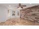 Bright bedroom with wood-look walls and a ceiling fan at 944 S Grand --, Mesa, AZ 85210