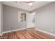 Bright bedroom with wood-look flooring and ceiling fan at 944 S Grand --, Mesa, AZ 85210