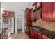 Kitchen with stainless steel appliances and dark wood cabinets at 944 S Grand --, Mesa, AZ 85210