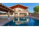 Home with a large pool, outdoor kitchen, and patio at 944 S Grand --, Mesa, AZ 85210