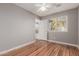Bedroom with wood flooring and access to a private balcony at 944 S Grand --, Mesa, AZ 85210