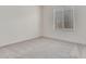 Well-lit bedroom with carpet and window at 21048 E Arroyo Verde Dr, Queen Creek, AZ 85142