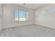 Well-lit bedroom with large windows and carpeted floor at 21048 E Arroyo Verde Dr, Queen Creek, AZ 85142